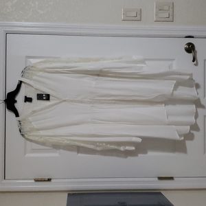 Torrid high low time with lace sleeves
